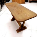 An early to mid 20th century oak trestle ended occasional table. 91cm x 36.5cm wide x 53.5cm high.