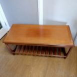 Mid 20th Century G-Plan teak coffee table with magazine shelf . 110cm long x 50cm wide x 53cm