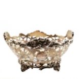 1901 sterling silver pierced bon-bon dish with chased decoration on 4 feet by Solomon Joel