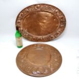 2 x Newlyn copper wall chargers - largest oval 68cm x 50cm is unmarked - the circular charger (48cm)