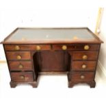 Antique mahogany kneehole desk with green leather insert (has damage) and brass gallery. 127cm