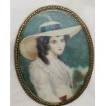 Portrait miniature of a young lady wearing a brimmed hat in an oval brass mount - 9cm x 7cm