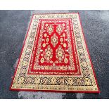 Red grounded large wool rug - 202cm x 292cm ~ slight damage to 1 edge