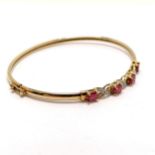 9ct marked gold bangle set with rubies & diamonds - 4.1g & 6cm across - SOLD ON BEHALF OF THE NEW