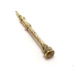 Antique gilt metal propelling pencil set with yellow stone - length extended 5cm