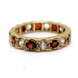 9ct hallmarked gold garnet & white stone eternity ring - size L & 2.9g total weight