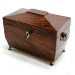 Antique mahogany tea caddy on brass feet with boxwood banding. Has original key. 20cm x 15cm x 12cm.