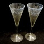 8 antique etched champagne flutes, 2 have small chips to the rims