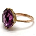 9ct hallmarked gold purple stone ring - size O½ & 4.5g total weight ~ stone has wear