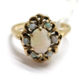 Unmarked gold opal cluster ring - size R½ & 3.7g total weight. Has chip to centre stone