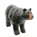 Black forest, Austrian carved wooden bear with glass eyes, 18cm long x 11cm high. Some surface