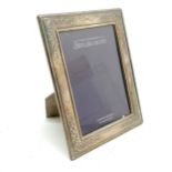 Sterling silver fronted photograph frame - 17cm x 22cm (glass a/f) - SOLD ON BEHALF OF THE NEW