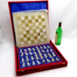 Onyx chess set with matching board (39cm square) in a red fitted case ~ 1 knight has been repaired