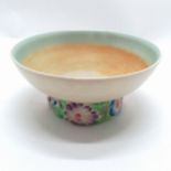 Clarice Cliff bowl with flower detail to the base. 17cm diameter x 8 cm high. Some discoloration