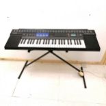 Casio Tone Bank CT-470 keyboard with folding stand and charger