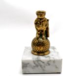 Tubal Cain products golfer brass car mascot in the form of a Dunlop Michelin man on a white marble