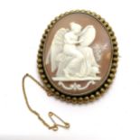 Antique metal mounted hand carved cameo brooch depicting a winged female figure with sword &