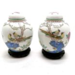 Pair of Oriental / Chinese ginger jars with bird decoration on carved wood stands - total height