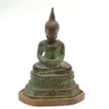 Early 20thC bronze cast Asian Buddha seated on a double lotus detailed base, on an associated wooden