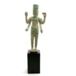 South east asian bronze deity figure on a black wood base - total height 46cm