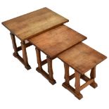 An oak nest of three tables, on standard end supports, the largest height 46cm. Additional