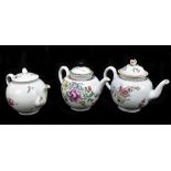 Three 18th century teapots, each of bulbous form with floral decoration, height of largest example