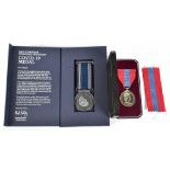 An Elizabeth II Imperial Service Medal, cased, and a mid-Yorkshire Hospitals NHS Trust Covid 19