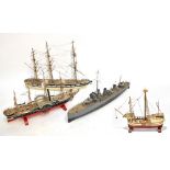 Four scratch-built models of boats including a steamer-type example, and a further model of a