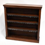 A Victorian walnut freestanding open bookcase.