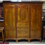 An Edwardian inlaid mahogany triple door wardrobe, with moulded cornice, with applied Greek key