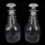 A pair of Georgian clear glass decanters with faceted and wheel cut decoration, height 16cm (2).