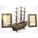 A wooden scratch-built model of a sailing boat, height 70cm, together with two modern prints
