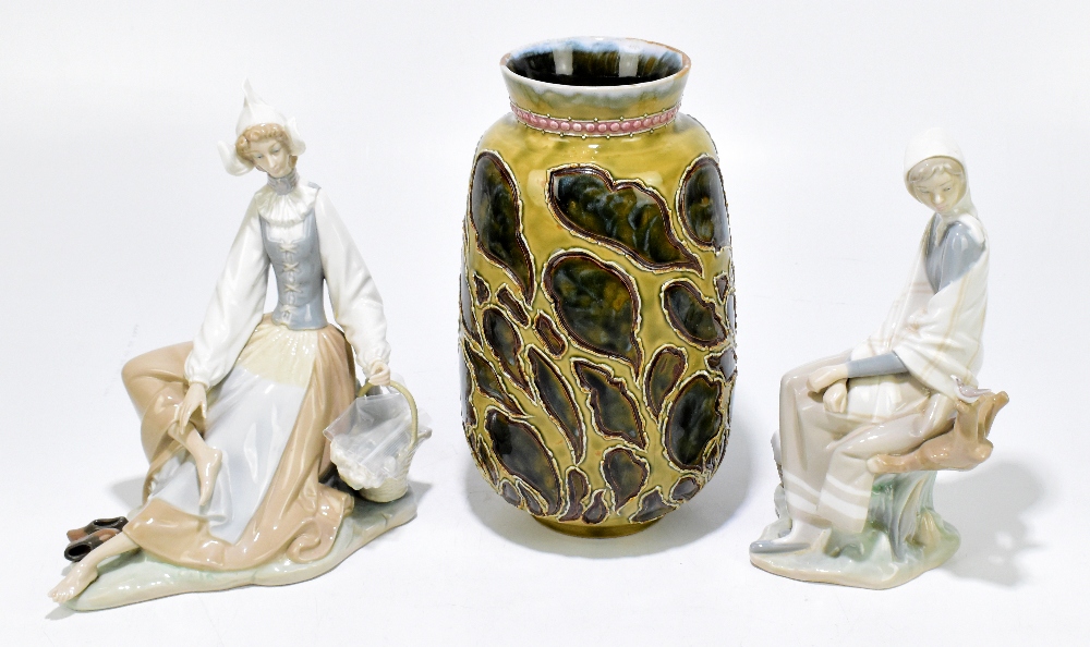 DOULTON LAMBETH; a stoneware vase modelled with leaf shaped detailing against a mottled green