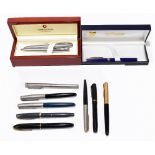 A collection of assorted fountain, ballpoint and propelling pens/pencils including a Sheaffer, a