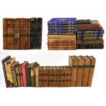 A collection of 18th century and later leather and cloth bound books to include R. MONTGOMERY