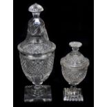 Two 19th century cut glass sweetmeat jars and covers, each raised on square plinth base, height
