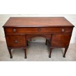 A Georgian inlaid mahogany sideboard, the large central drawer above carved arch shaped secret