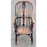 A 19th century beech and ash Windsor type chair, with hoop back and solid seat with crinoline