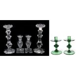 A pair of 19th century glass candlesticks, raised on a double knop stem terminating on a baluster