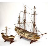 A large wooden scratch-built model of a galleon, height 62cm, together with a smaller example (