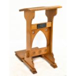 A mid 20th century light oak lectern bearing plaque inscribed 'In Memory of FLT. SGT. Eric