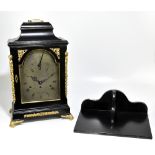 JAMES WOOD OF LONDON; a fine George III ebonised bracket clock, the swing brass handle above