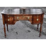 An early 19th century mahogany sideboard of small proportions, central drawer flanked by two pot