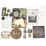 A WWI medal and memorial plaque group comprising British War Medal and Victory Medal awarded to
