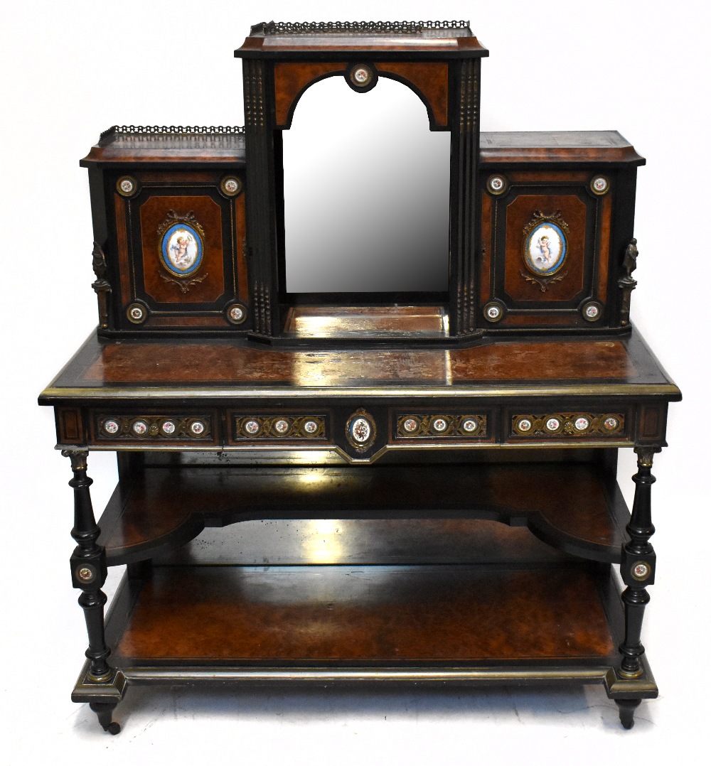 A late Victorian amboyna veneered ebony gilt metal and porcelain mounted bonheur de jour, the