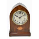 An Edwardian inlaid mahogany lancet topped mantel clock, the silvered dial with Arabic numerals