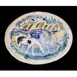 A Continental faienceware bowl with folded rim, decorated with horses and cart in landscape scene,