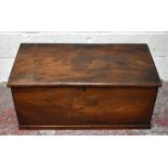 A stained pine blanket chest with metal side handles, raised on plinth base, width 94cm, depth 48cm,