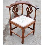 A George III oak corner chair, with pierced splats and drop-in seat, height 84cmAdditional