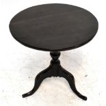 A Georgian oak tilt-top tripod table raised on splayed legs.Additional InformationTop with an old